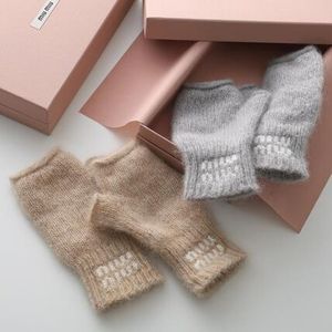 MIUMIU 手袋 5GG196 2CQD グローブ ロゴ